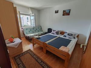 Postel nebo postele na pokoji v ubytování Apartmani Vodice
