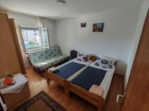 Postel nebo postele na pokoji v ubytování Apartmani Vodice