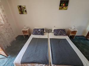 Postel nebo postele na pokoji v ubytování Apartmani Vodice