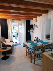 a living room with a table and a couch at House ViEn in Nerezine