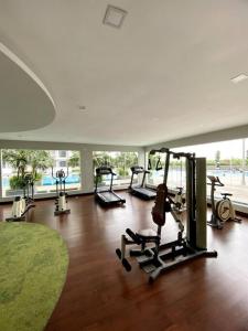 a gym with several treadmills and machines in a room at 1610 The Platino 5min to Paradigm Sutera JB in Johor Bahru