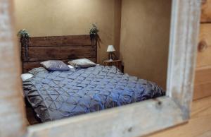 Postel nebo postele na pokoji v ubytování Les Gîtes de Sprimont - Le Cottage