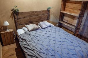 Postel nebo postele na pokoji v ubytování Les Gîtes de Sprimont - Le Cottage