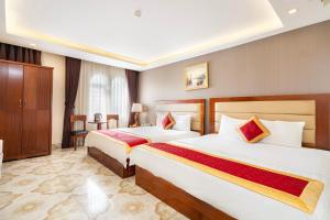 Postel nebo postele na pokoji v ubytování Kadupul Hotel