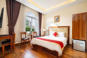 Postel nebo postele na pokoji v ubytování Kadupul Hotel