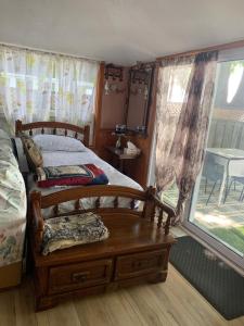 a bedroom with a bed and a table and a window at "Hook, Line,& Sinker"-At the edge of Erie 7 plus 1 in Kingsville