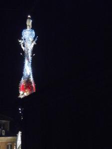 a christmas tree is lit up at night at Around the Medieval Tower in Viterbo