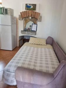 Postel nebo postele na pokoji v ubytování Apartmani Milenko Lubenice