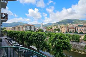 a city with cars parked in a parking lot at Caraluna Vacanze - Rapallo in Rapallo
