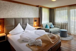 Postel nebo postele na pokoji v ubytování Vitalpina Hotel Magdalenahof