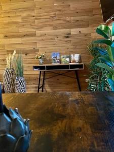 a table in a room with a wooden wall at "Erfurt genießen" in Erfurt