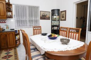 a kitchen with a table with a bowl of fruit on it at Villa Elena Gorice in Berat