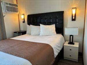 Postel nebo postele na pokoji v ubytování Motel vue Belvédère
