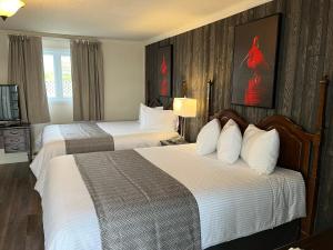 Postel nebo postele na pokoji v ubytování Motel vue Belvédère