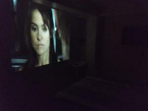 クスコにあるHome betty'sの暗い部屋の鏡の中の女性