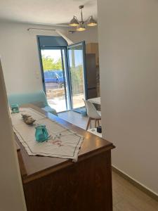 a kitchen with a table with a vase on it at Theros house in Kythira