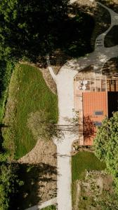 an aerial view of a house on a road at Balia i Las Domek nad jeziorem MoreLife House in Tuczno