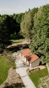 an overhead view of a building with a roof at Balia i Las Domek nad jeziorem MoreLife House in Tuczno +44 photos
