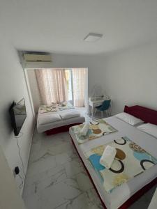 Postel nebo postele na pokoji v ubytování Apartments Bibic