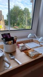 a kitchen counter with a window and a cutting board at Gynack Villa in Kingussie