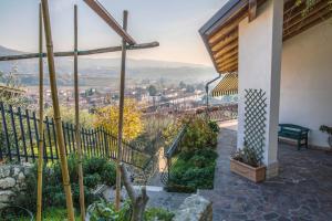 a balcony with a view of a city at B&B Casa Degli Ulivi in Negrar