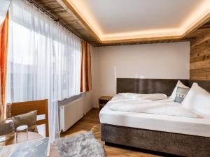 Posteľ alebo postele v izbe v ubytovaní Tennenwirt Guesthouse - Adults only