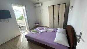 Postel nebo postele na pokoji v ubytování Apartments Toro Bar Sutomore