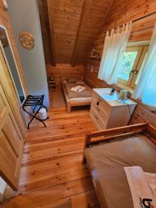 an overhead view of a bedroom in a log cabin at Holiday home LUNA in Donje Orešje