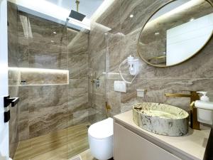 a bathroom with a sink and a mirror at Zace Studios in Ksamil