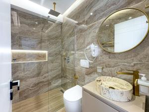 a bathroom with a sink and a mirror at Zace Studios in Ksamil