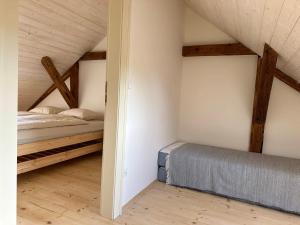 Rúm í herbergi á Apartmány Hodňov 17