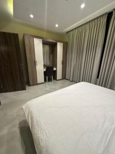 Ένα ή περισσότερα κρεβάτια σε δωμάτιο στο Chic Apartments For Rent ave2-9