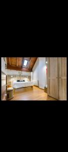 a large bedroom with a bed and a window at Casa Palacin in Guasillo