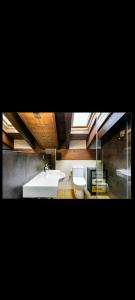 a bathroom with a sink and a toilet at Casa Palacin in Guasillo +9 photos