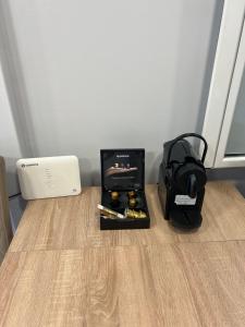 a box of bullets sitting on a table with a modem at Studio next to the Beach in Vouliagmeni