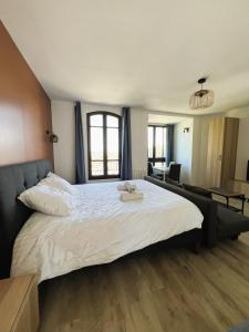 En eller flere senge i et værelse på villa Konny studio rez-de-chaussée