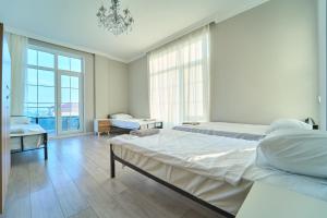 Postel nebo postele na pokoji v ubytování Premium Sea View Hotel & Hostel
