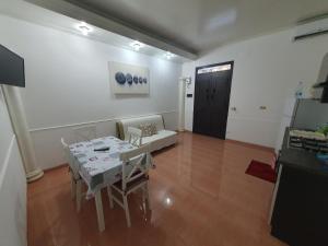 a living room with a table and a couch at A casa di Picci in Avola