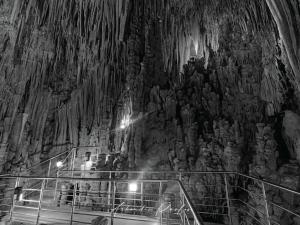 a boat in a cave with a rock wall at Paul's house in Veliés