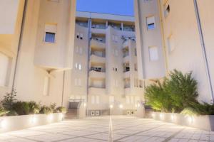a large building with a courtyard in front of it at Dule Lux in Jagodina