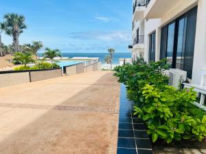 a balcony of a building with a view of the ocean at Relax Oceanfront Suites in Sere Kunda +64 photos