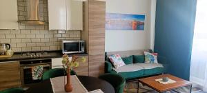 Kuchyň nebo kuchyňský kout v ubytování Two bedroom loft apartment with outdoor area, served with lift