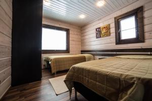 Ένα ή περισσότερα κρεβάτια σε δωμάτιο στο Levi Holidays