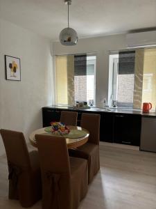 a kitchen and dining room with a table and chairs at Anna in Livno