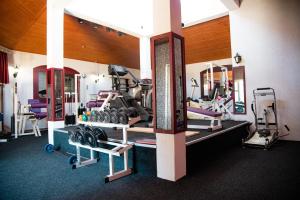 a room with a gym with several tread machines at Hotel Istatov in Nov Dojran