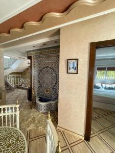 a lobby with a tub in the middle of a room at villa victoria in Tétouan