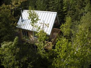 an aerial view of a house in the trees at Les Cabines St-O #1 in Saint-Onésime