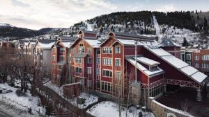a group of buildings with snow on the roofs at Marriott Summit Watch 1BD in Park City