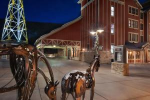 a metal sculpture of a horse in front of a building at Marriott Summit Watch Luxury Studio in Park City