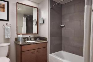 a bathroom with a sink and a tub and a toilet at Marriott Summit Watch Luxury Studio in Park City +32 photos